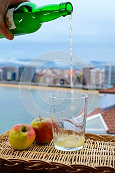 Traditional natural Asturian cider made fromÂ fermented apples in barrels should be poured from great height for air